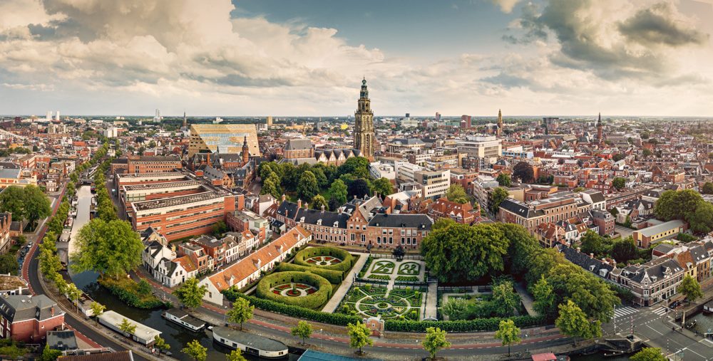 Aerial panorama of Groningen, Netherlands, with the Martini Tower and a formal garden among the rooftops